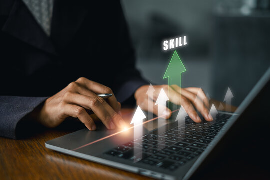 Businessperson enhancing skills on a laptop with growth arrows, symbolizing career advancement and personal development.