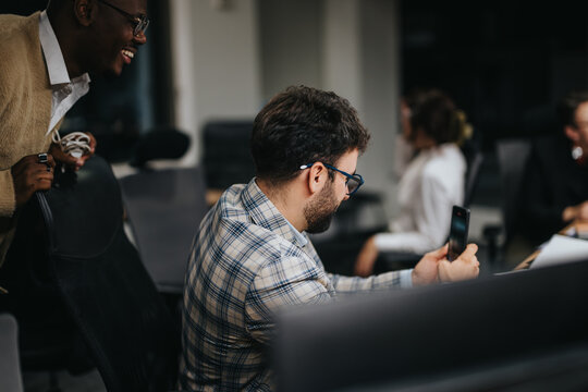 A team of diverse colleagues working late at night, engaged in a strategy meeting. They're discussing and analyzing project plans, showcasing collaboration and commitment to meeting deadlines.