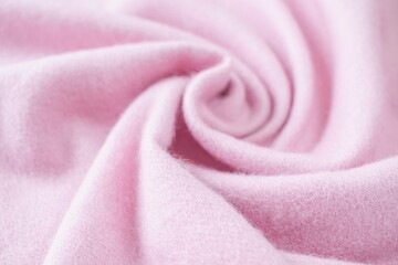 Cashmere pink stole. Texture, background, drapery. Fabric made of natural wool and silk, pastel pink color.
