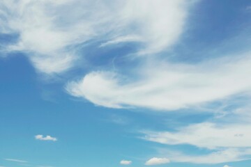 Blue sky with beautiful white clouds. Sky with cumulus and cirrocumulus clouds.