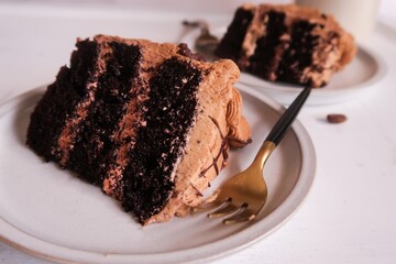 Homemade Chocolate cake with coffee buttercream icing, selective focus