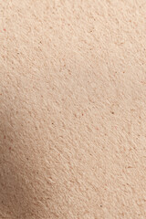 Fototapeta premium Close-up of textured handmade paper with natural fibers