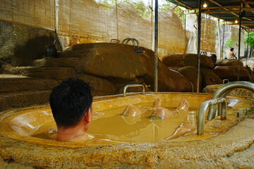 Man relaxing in Mud Bath in Nha Trang, Vietnam - ベトナム ニャチャン 泥風呂に入る男性