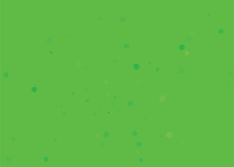 Abstract background with small colorful confetti on a bright green field