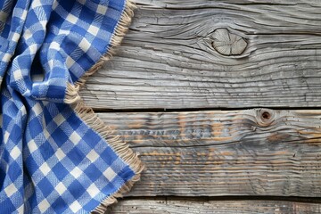 Rustic wooden surface featuring a blue checkered napkin with ample space for text or design