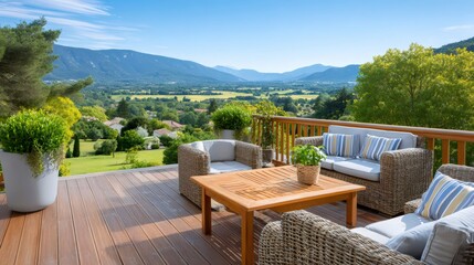 Wooden terrace overlooking valley with mountains and garden furniture