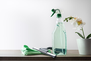 Window cleaner tools on wood table isolated background