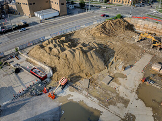 Cincinnati, United States - 18 July 2025: Aerial view of a construction site where earth and concrete meet the sky, creating a symphony of textures and tones.