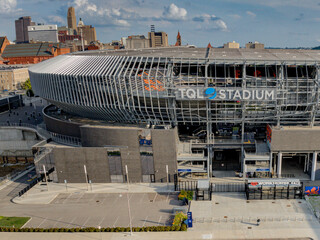 Cincinnati, United States - 18 July 2025: Aerial view of the TQL Stadium, a modern architectural marvel, stands in stark contrast to the city skyline.