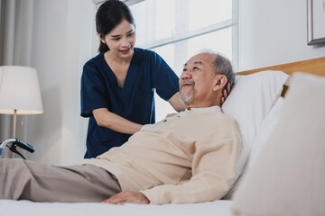 Obraz premium Happy woman nurse, daughter take care to sick old senior elderly patient in home or house in medical and healthcare treatment.