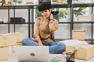 curly beautiful seller woman check order on laptop, teenager start up and working online