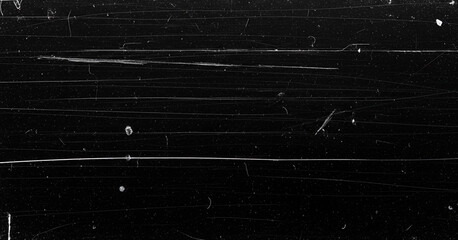Distressed black background with sharp horizontal streaks, dust particles, and random white scratches resembling damaged film or scratched metal plates.