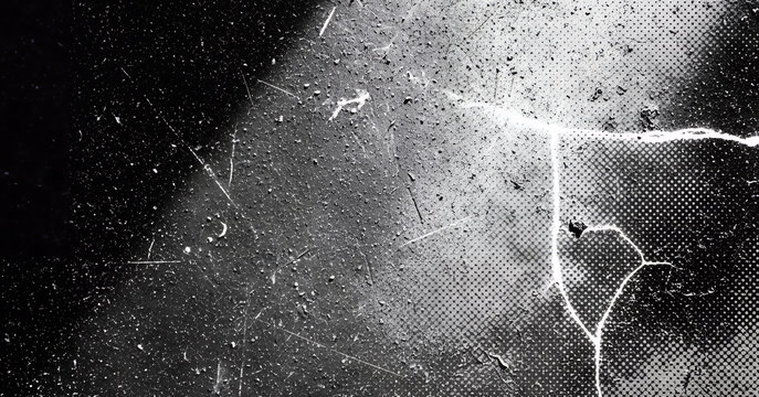 A cracked and dusty black surface with fine scratches, grainy speckles, and halftone dot texture gradients, creating a gritty, high contrast composition.