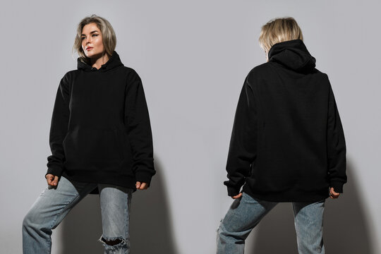Confident Woman Wearing Oversized Black Hoodie with Blank Space for Mockup