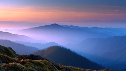Fototapeta premium Majestic mountain range at dawn showcases layers of peaks shrouded in mist, creating a serene landscape with a soft, pastel-colored sky and a sense of depth and tranquility.