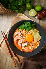 Tom yum kung with noodles  , thai style instant spicy noodles with shrimp and egg , noodles tom yum with shrimp and egg 