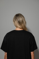 Wearing Oversized  Black T-Shirt with Blank Space for Mockup