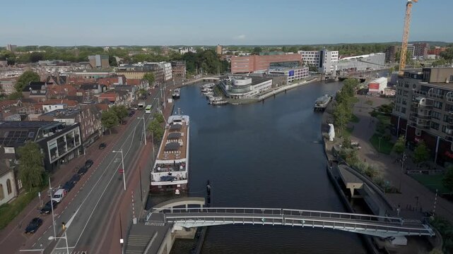 Alkmaar, Netherlands. 07-21-2025. Aerial View Flying Over the Noordhollandsch Kanaal from Ringersbrug Towards Police Station