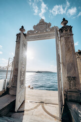 Ornate Gate Overlooking a Scenic Ocean View on a Clear Sunny Day