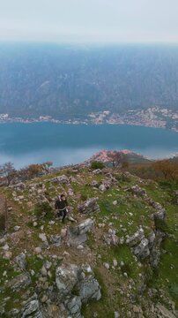The top of Mount Vrmac near the Bay of Kotor, Montenegro - drone view vertical