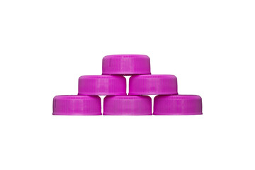 Six pink plastic bottle caps stacked in pyramid shape are isolated.