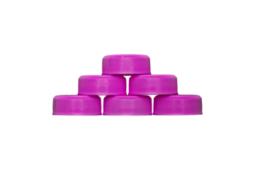 Six pink plastic bottle caps stacked in pyramid shape are isolated.