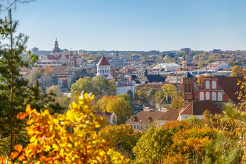 Overlooking the historic old town of Vilnius, Lithuania, with vibrant autumn trees, perfect for...