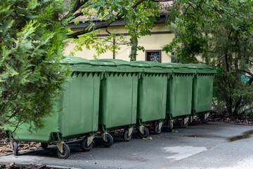 Urban Cleanliness Concept: Trash Bins by Public Restroom in City Park