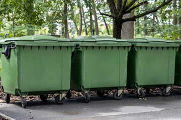 Urban Cleanliness Concept: Trash Bins by Public Restroom in City Park