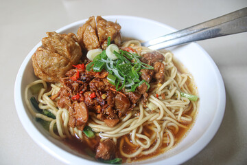 Delicious Indonesian Chicken Noodle Soup with Meatballs and Fried Shallots