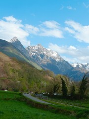 Snow-capped mountains rise majestically against a bright blue sky