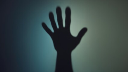 Shadow of a hand silhouette with outstretched fingers. Abstract and mysterious. Art and creativity, concept. The idea of reach and expression.