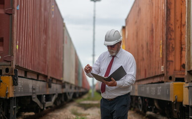 Engineer manager and a secretary working together railway track during inspection or routine...