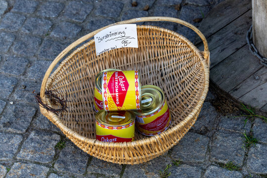 Hudikskvall, Sweden A basket at a souvenir shop sells cans of surstromming, or Swedish fermented fish, a delicacy.