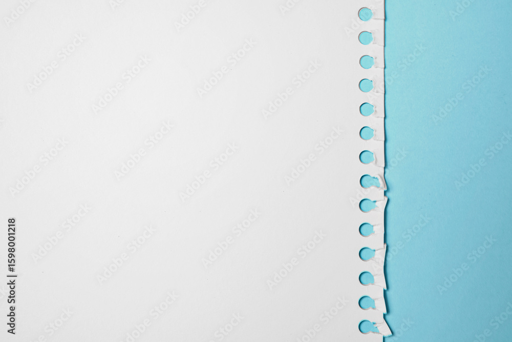 Aufkleber notebook sheet. torn page from a notebook on a blue background. copy space