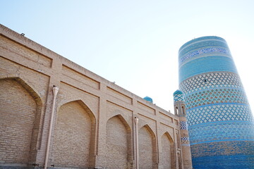 Kalta-minor Minaret and Walled Fortress known as Itchan Kala in Khiva, Uzbekistan -...