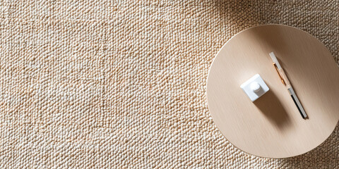 Round Wooden Tabletop with Inkwell and Pens on Beige Carpet