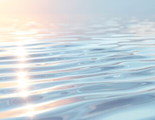 Tranquil water surface with gentle ripples reflecting the soft light of a serene sunrise. A peaceful and calming background concept.
