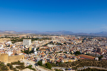 Panoramic view of Alicante, Spain showcasing the city's vibrant skyline, colorful buildings, and...