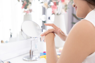 Skincare, selfcare, beauty, hands, woman lifestyle skincare gently applying lotion in daily care...