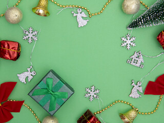 Colorful Christmas decorations and wrapped gifts on a green background, perfect for holiday themes