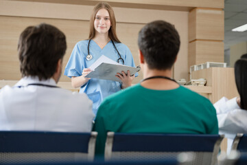 Team Doctor listening medical Caucasian woman student present at hospital