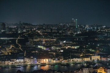 Porto comes alive at night, revealing colorful buildings along the Douro. Gentle light highlights...