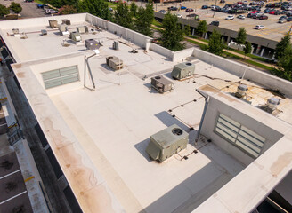 Sunny Daytime Drone Images of TPO Flat Roofs on Commercial and Residential Buildings in Raleigh...