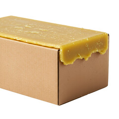 Block of Beeswax on Cardboard Box Isolated