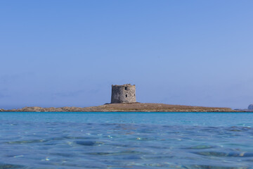 Caletta della Torre beautiful view of ruined tower on la pelosa beach sardinia italy
