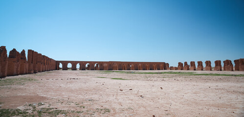 Historic ruins of Abu Dulaf reveal ancient architecture amidst vast desert landscape