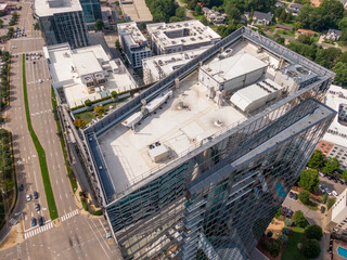 Sunny Daytime Drone Images of TPO Flat Roofs on Commercial and Residential Buildings in Raleigh...