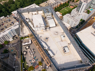 Sunny Daytime Drone Images of TPO Flat Roofs on Commercial and Residential Buildings in Raleigh...