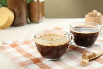 Aromatic instant coffee with sugar on table, closeup